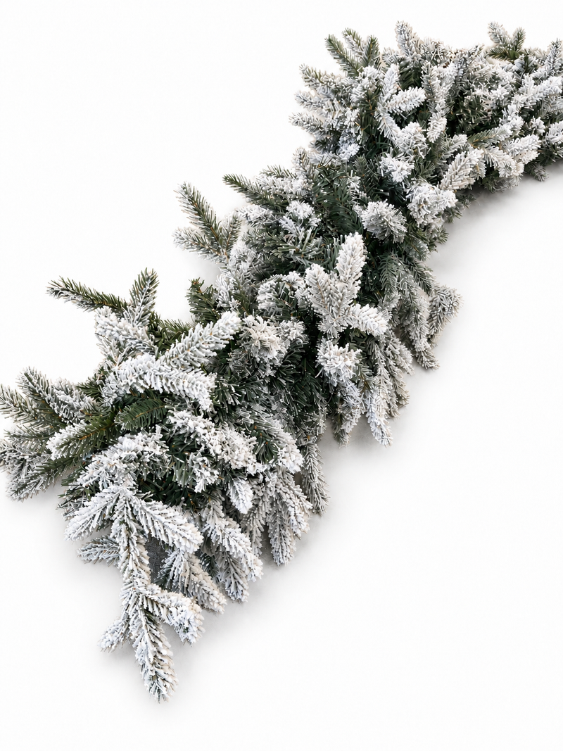 Detail of the heavy white snow flocking on Christmas garland branches